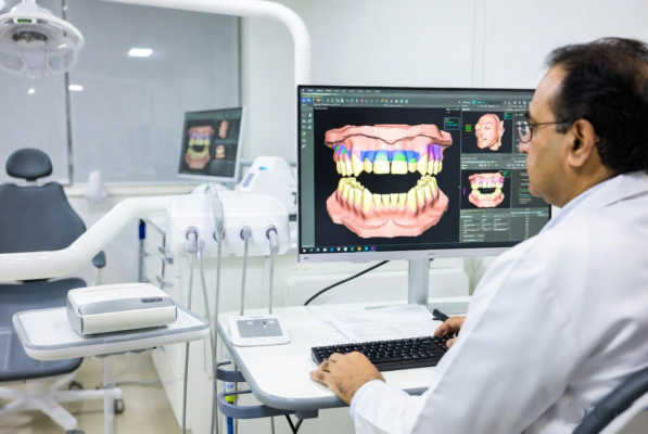 Dentist reviewing a 3D dental model of a patient’s teeth on a monitor.